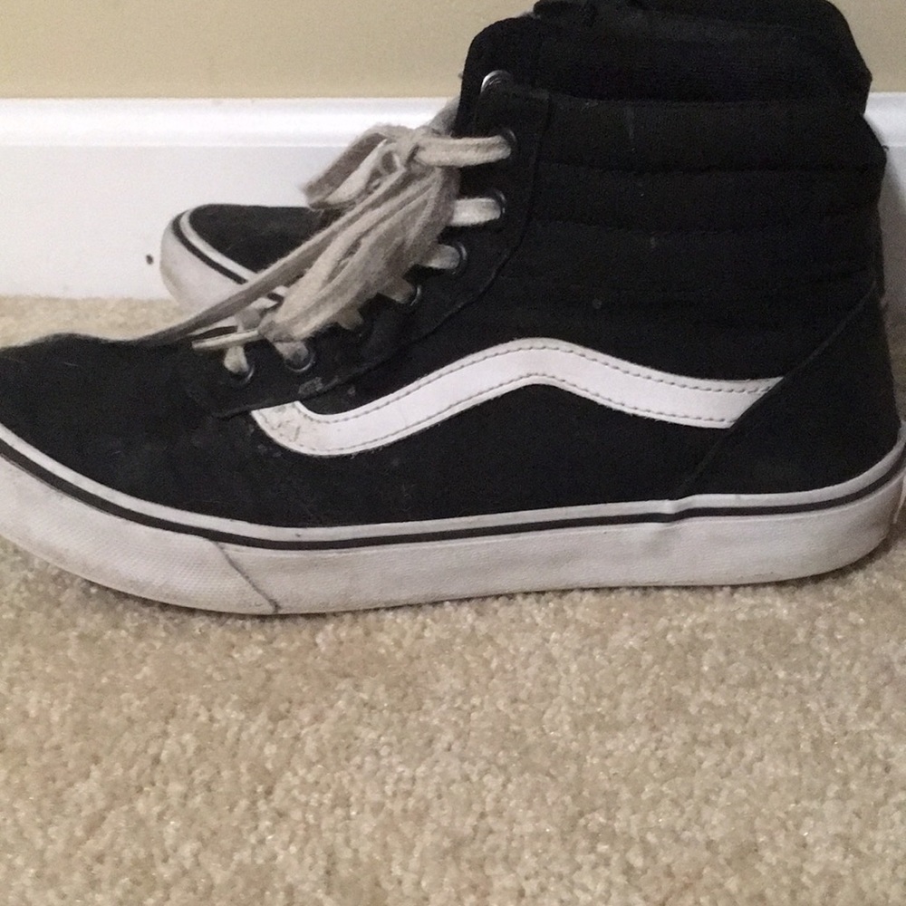 Black and white high top vans
